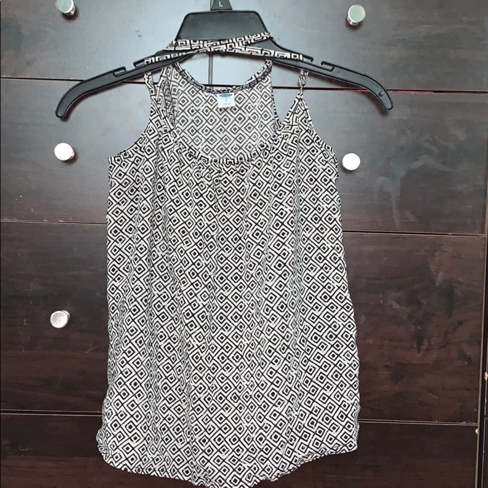 crossed strapped shirt .